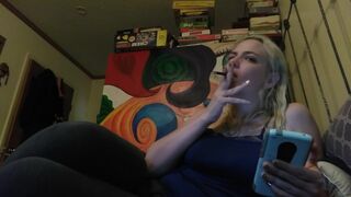 Hot blonde smokes clove cigarettes, plays on phone and plays with tits - 3 image