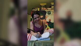 Tickles feet in tube socks with feather