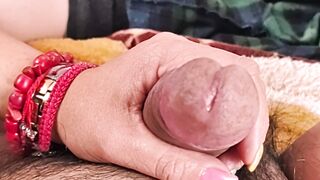 She masturbates me and my penis gets wet with droplets of pleasure.