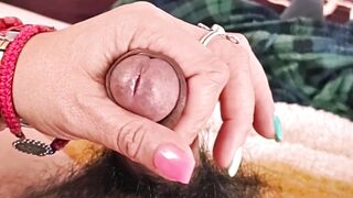 She masturbates me and my penis gets wet with droplets of pleasure.