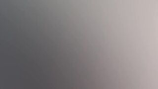 Gothic chick strokes a huge cock in the middle of the forest