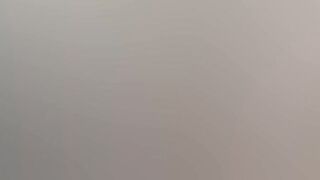 Gothic chick strokes a huge cock in the middle of the forest