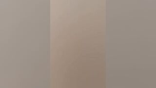 Gothic chick strokes a huge cock in the middle of the forest