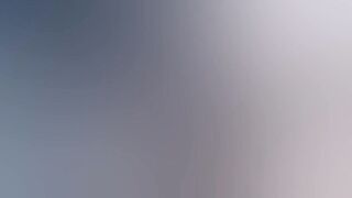 Gothic chick strokes a huge cock in the middle of the forest